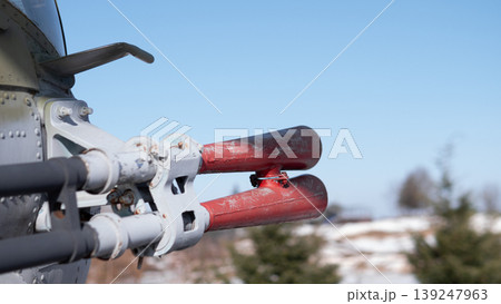 Closeup Aircraft Rocket Tips On Pylon, Weathered Red Paint, Exposed Mounting Hardware, Metal Fuselage Edge, Snowdusted Landscape, Clear Blue Sky, Shallow Depth Of Field, Maintenance Closeup Aircraft Rocket Tips On Pylon, Weathered Red Paint, Exposed Mounting Hardware, Metal Fuselage Edge, Snowdusted Landscape, Clear Blue Sky, Shallow Depth Of Field, Maintenance 139247963