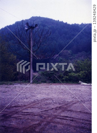 Rural Landscape with Wind Turbine and Mountain 139248429