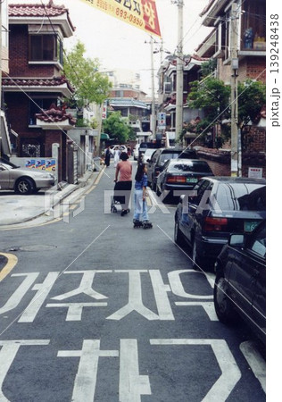 Korean Residential Street with Pedestrians and Vehicles 139248438