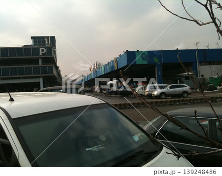 Urban Parking Lot with Commercial Building Urban Parking Lot with Commercial Building 139248486