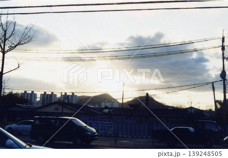 Urban Sunset with Power Lines and Buildings 139248505