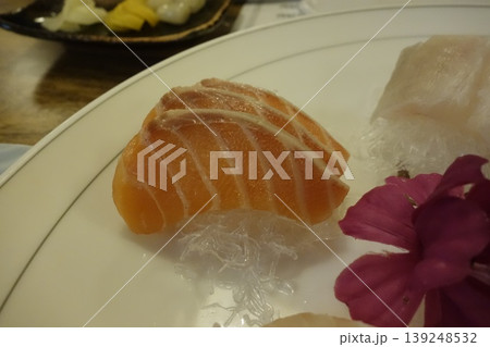 Salmon Sashimi with Garnish on White Plate 139248532