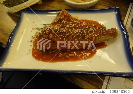 Sesame-Topped Fried Dish with Red Sauce on Plate Sesame-Topped Fried Dish with Red Sauce on Plate 139248566