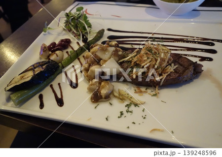 Gourmet Steak Plate with Asparagus and Garnishes 139248596
