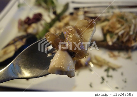 Fork with Grilled Fish and Sauce Close-up Fork with Grilled Fish and Sauce Close-up 139248598