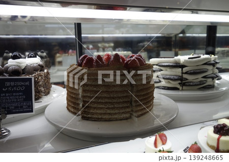 Bakery Display Case with Assorted Cakes 139248665