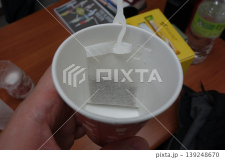 Tea Bag in Disposable Cup with Stirrer 139248670