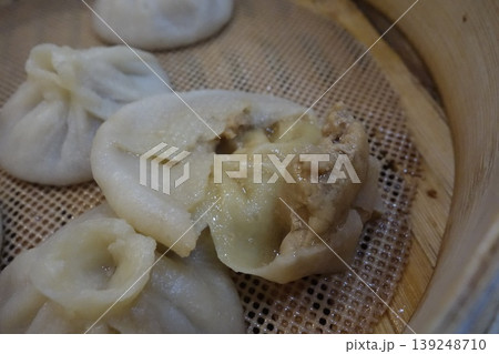 Steamed Buns with Visible Filling in Bamboo Steamer 139248710