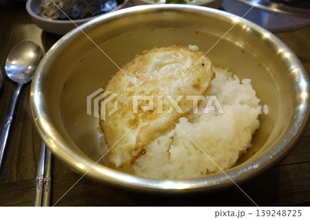 Fried Egg Over Rice in Metal Bowl Fried Egg Over Rice in Metal Bowl 139248725