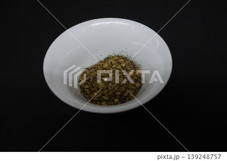 Dried Herbs in White Bowl on Black Background Dried Herbs in White Bowl on Black Background 139248757