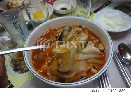 Spicy Seafood Soup with Spoon in Bowl 139248864
