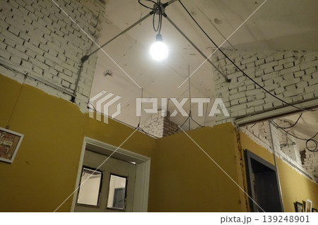Industrial Interior with Exposed Brick and Ceiling Wiring Industrial Interior with Exposed Brick and Ceiling Wiring 139248901