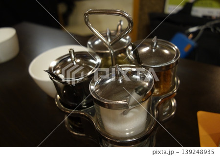 Metal Condiment Shakers on Table Metal Condiment Shakers on Table 139248935