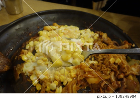 Spoonful of Corn and Cheese Over Korean Mixed Dish 139248984