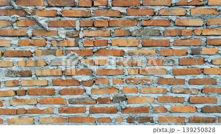 Traditional red brick wall texture with rough cement mix. Traditional red brick wall texture with rough cement mix. 139250828