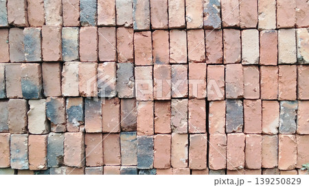 Traditional red brick wall texture with rough cement mix. Traditional red brick wall texture with rough cement mix. 139250829