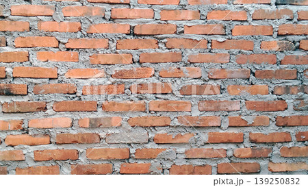 Traditional red brick wall texture with rough cement mix. Traditional red brick wall texture with rough cement mix. 139250832