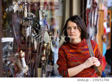Woman tourist chooses souvenirs traditional for city of Toledo. Spain 139251766
