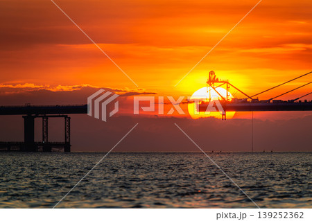 Sunset over Danjiang Bridge Construction in New Taipei City Taiwan Sunset over Danjiang Bridge Construction in New Taipei City Taiwan 139252362
