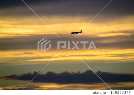 Airplane Flying Over Tamsui Bridge at Sunset in New Taipei City Airplane Flying Over Tamsui Bridge at Sunset in New Taipei City 139252377