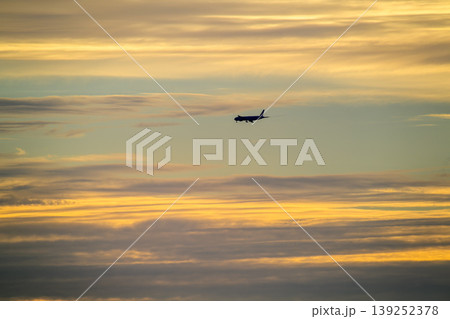 Airplane flying over Tamsui Bridge at sunset in New Taipei City Airplane flying over Tamsui Bridge at sunset in New Taipei City 139252378