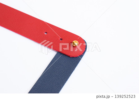 dark blue and red leather strap isolated on white background dark blue and red leather strap isolated on white background 139252523