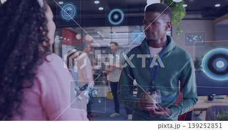Holding travel mug, Black man in green hoodie viewing digital overlays in office, copy space Holding travel mug, Black man in green hoodie viewing digital overlays in office, copy space 139252851