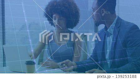 Analyzing data, manager in suit jacket and analyst working at table with laptop, grid overlay Analyzing data, manager in suit jacket and analyst working at table with laptop, grid overlay 139253188