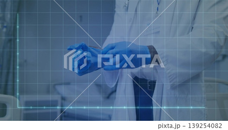 Doctor in lab coat pulling on blue nitrile gloves in hospital room, with patient bed, stethoscope Doctor in lab coat pulling on blue nitrile gloves in hospital room, with patient bed, stethoscope 139254082