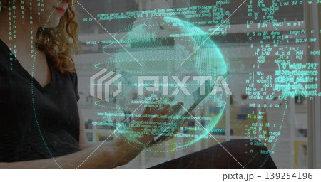 Holding tablet touchscreen projecting holographic globe and code on desk at home office, copy space 139254196