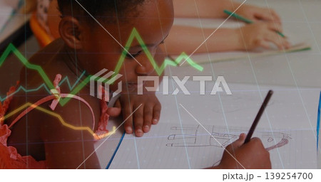 Girl in pink sleeveless top drawing figure in classroom, with pencil and line graph overlay Girl in pink sleeveless top drawing figure in classroom, with pencil and line graph overlay 139254700
