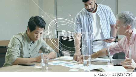 Collaborating professionals reviewing charts using devices in conference room, with water glasses Collaborating professionals reviewing charts using devices in conference room, with water glasses 139254754