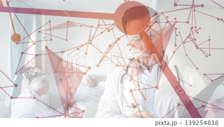 Writing doctor in white coat reviewing clipboard in hospital ward, with stethoscope and red overlay Writing doctor in white coat reviewing clipboard in hospital ward, with stethoscope and red overlay 139254838