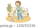 リビングで掃除機をかける笑顔の若い女性 家事イメージ リビングで掃除機をかける笑顔の若い女性 家事イメージ 139255230