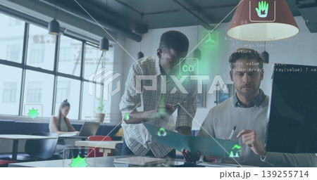 Pointing software developer guiding project manager in office, with teal folder and data overlay Pointing software developer guiding project manager in office, with teal folder and data overlay 139255714