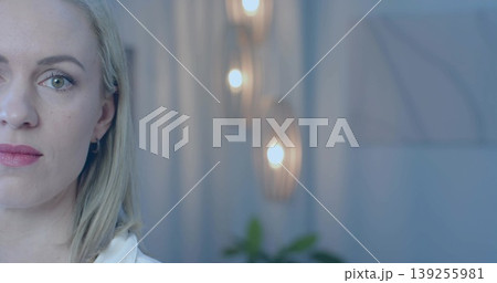 Gazing thoughtfully mid adult woman turning her head in office, with wooden sconces, copy space Gazing thoughtfully mid adult woman turning her head in office, with wooden sconces, copy space 139255981