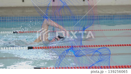 Swimming adult male with dark swim cap, goggles and trunks, executing front crawl in lap pool Swimming adult male with dark swim cap, goggles and trunks, executing front crawl in lap pool 139256065