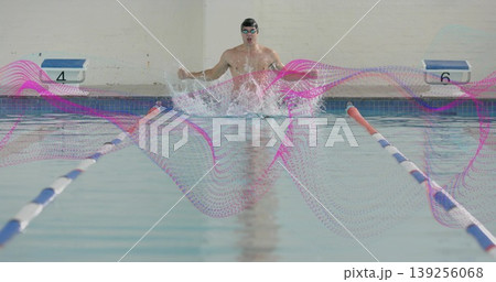 Breaststroke kicking swimmer in pool lane, with briefs, dividers, blocks 4 and 6, magenta overlay Breaststroke kicking swimmer in pool lane, with briefs, dividers, blocks 4 and 6, magenta overlay 139256068