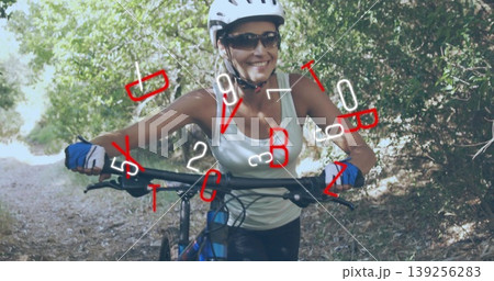 Navigating woman cyclist steering mountain bike on forest trail, in white helmet and cycling gloves Navigating woman cyclist steering mountain bike on forest trail, in white helmet and cycling gloves 139256283