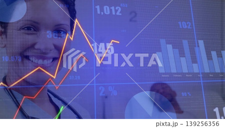 Standing Dr wearing stethoscope in office, with graphs, bar or pie charts, data overlays, copy space 139256356