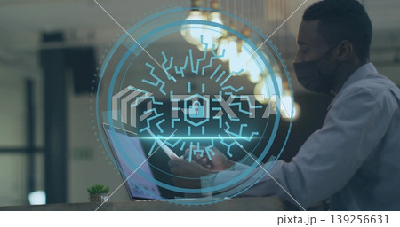 Standing masked man checking smartphone at reception, laptop succulent padlock overlay, copy space Standing masked man checking smartphone at reception, laptop succulent padlock overlay, copy space 139256631
