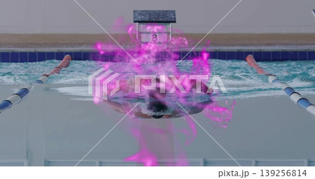 Swimming butterfly stroke cutting through water near lane ropes, block 8, with purple digital glow 139256814