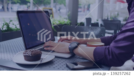 Typing Asian man wearing smartwatch at cafe with laptop, muffin, fork, coffee, phone, copy space Typing Asian man wearing smartwatch at cafe with laptop, muffin, fork, coffee, phone, copy space 139257262