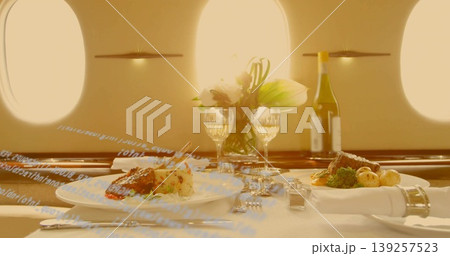Featuring gourmet plated meals in private jet cabin, with wine, flowers and salt and pepper shakers 139257523