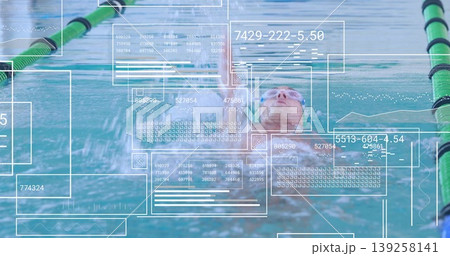 Gliding swimmer wearing cap, goggles performing backstroke in pool lane, with digital data overlays Gliding swimmer wearing cap, goggles performing backstroke in pool lane, with digital data overlays 139258141