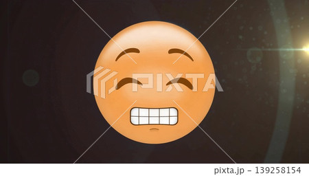 Floating yellow-orange emoticon face drifting in cosmic scene, with lens flare and light particles 139258154