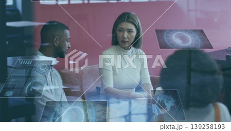 Leading discussion woman wearing turtleneck in office lounge, with red partition and digital panels Leading discussion woman wearing turtleneck in office lounge, with red partition and digital panels 139258193