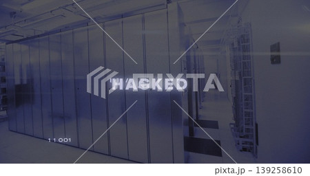 Server and network racks lining dim data center corridor, showing floor tiles and HACKED overlay 139258610