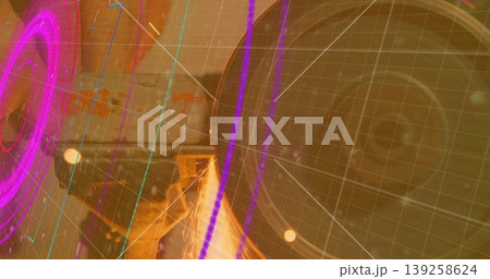 Rotating grinder wheel generating sparks on workpiece in shop, with neon HUD overlay, copy space Rotating grinder wheel generating sparks on workpiece in shop, with neon HUD overlay, copy space 139258624