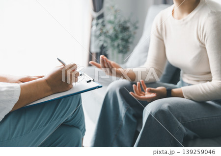 Mental health counseling concept with woman expressing feelings to therapist during session at home, showing open communication, emotional support, trust, reflection and healing progress. Mental health counseling concept with woman expressing feelings to therapist during session at home, showing open communication, emotional support, trust, reflection and healing progress. 139259046